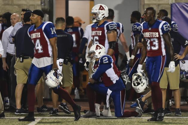 MONTREAL, QC - AUGUST 03:  Quarterback Johnny Manziel #2 of the Montreal Alouettes is on one knee while his teammates walk off the field against the Hamilton Tiger-Cats during the CFL game at Percival Molson Stadium on August 3, 2018 in Montreal, Quebec, Canada.  The Hamilton Tiger-Cats defeated the Montreal Alouettes 50-11.  (Photo by Minas Panagiotakis/Getty Images)