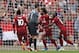 Liverpool's Egyptian midfielder Mohamed Salah (C) celebrates with teammates after scoring the opening goal of the English Premier League football match between Liverpool and West Ham United at Anfield in Liverpool, north west England on August 12, 2018. (Photo by Oli SCARFF / AFP) / RESTRICTED TO EDITORIAL USE. No use with unauthorized audio, video, data, fixture lists, club/league logos or 'live' services. Online in-match use limited to 120 images. An additional 40 images may be used in extra time. No video emulation. Social media in-match use limited to 120 images. An additional 40 images may be used in extra time. No use in betting publications, games or single club/league/player publications. / (Photo credit should read OLI SCARFF/AFP/Getty Images)