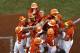 Lufkin, Texas' Collin Ross, center, is greeted by teammates after hitting a three-run home run off Fairfield, Conn., pitcher Matthew Vivona in the first inning of a Little League World Series baseball game in South Williamsport, Pa., Thursday, Aug. 24, 2017. Texas won 14-4. (AP Photo/Gene J. Puskar)