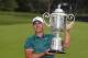 Brooks Koepka poses with the Wanamaker Trophy after winning the PGA Championship golf tournament at Bellerive Country Club, Sunday, Aug. 12, 2018, in St. Louis. (AP Photo/Jeff Roberson)