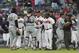Miami Marlins catcher J.T. Realmuto (11) stands between pitcher Jose Urena (62) and Atlanta Braves manager Brian Snitker (43) as the dugouts empty after Urena hit Braves' Ronald Acuna Jr. with a pitch during the first inning of a baseball game Wednesday, Aug. 15, 2018m in Atlanta. Marlins' Derek Dietrich (32) and Braves' Ender Inciarte argue at right. (AP Photo/John Bazemore)