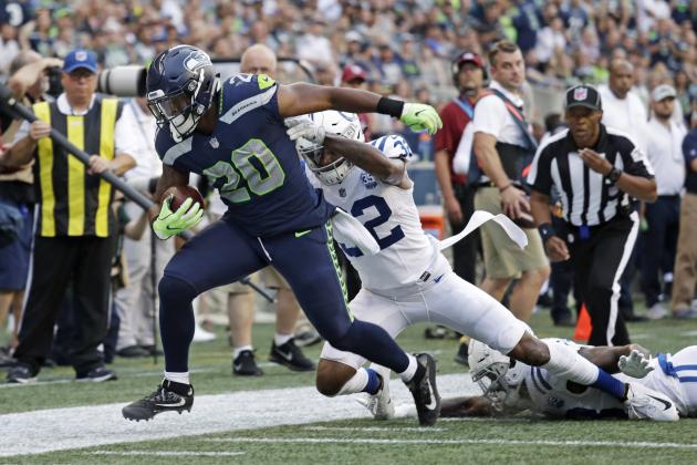 Seattle Seahawks running back Rashaad Penny (20) is tackled by Indianapolis Colts defensive back T.J. Green (32) during the first half of an NFL football preseason game, Thursday, Aug. 9, 2018, in Seattle. (AP Photo/Elaine Thompson)