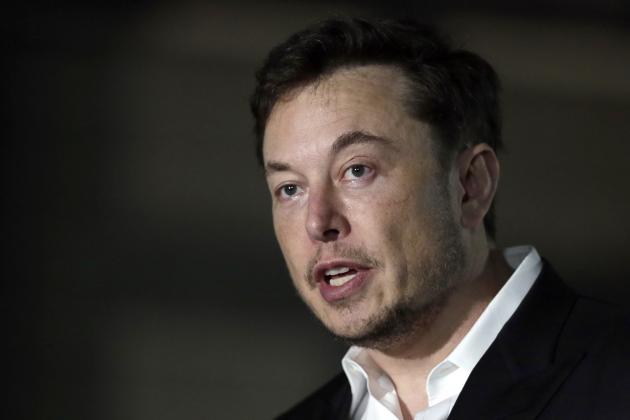 FILE - In this June 14, 2018, file photo, Tesla CEO and founder of the Boring Company Elon Musk speaks at a news conference in Chicago. Board members at Tesla are evaluating Musk’s $72 billion proposal to take the electric car and solar panel maker private. Six of nine members say in a statement Wednesday, Aug. 8, that Musk began talking with the board about the move last week.  (AP Photo/Kiichiro Sato, File)