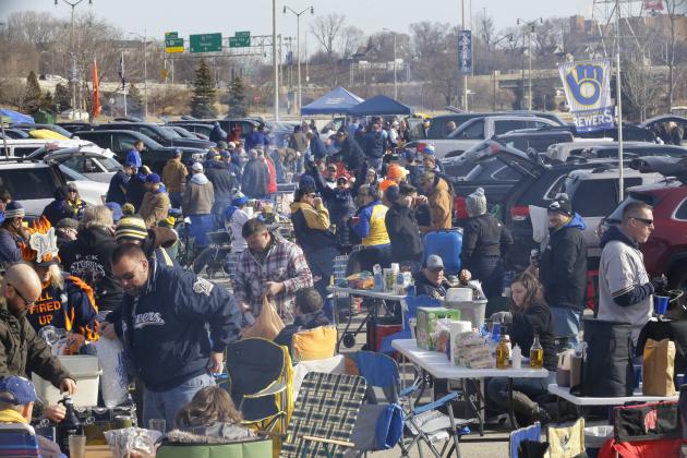 Fans tailgate in the parking lot of Miller Park before a home opener baseball game between the Milwaukee Brewers and St. Louis Cardinals Monday, April 2, 2018, in Milwaukee. (AP Photo/Jeffrey Phelps)