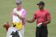 Tiger Woods and his caddie Joe Lacava, look down the third fairway, during the final round of The Players Championship golf tournament, Sunday, May 13, 2018, in Ponte Vedra Beach, Fla. (AP Photo/Lynne Sladky)
