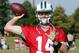 New York Jets quarterback Sam Darnold (14) warms up during the New York Jets Washington Redskins NFL football training camp in Richmond, Va., Tuesday, Aug. 14, 2018. (AP Photo/Steve Helber)