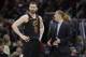 Cleveland Cavaliers' Tyronn Lue talks with Kevin Love in the second half of Game 4 of basketball's NBA Finals against the Golden State Warriors, Friday, June 8, 2018, in Cleveland. (AP Photo/Tony Dejak)