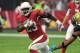 GLENDALE, AZ - NOVEMBER 26: Adrian Peterson #23 of the Arizona Cardinals runs with the football in front of Jalen Ramsey #20 of the Jacksonville Jaguars in the first half at University of Phoenix Stadium on November 26, 2017 in Glendale, Arizona. (Photo by Norm Hall/Getty Images)