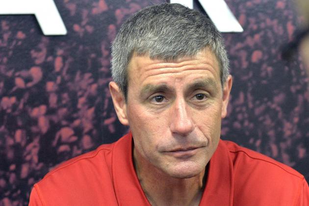 Louisville offensive line coach Chris Klenakis, left, talks with a reporter during Louisville Football Media Day at Papa John's Cardinal Stadium in Louisville, Ky., Saturday, Aug. 8, 2015. (AP Photo/Timothy D. Easley)