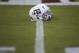 Texas A&M helmets sit on the 50 yard line before the start of an NCAA college football game against South Carolina Saturday, Sept. 30, 2017, in College Station, Texas. (AP Photo/Sam Craft)