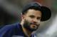 HOUSTON, TX - AUGUST 09: Jose Altuve #27 of the Houston Astros looks on from the bench at Minute Maid Park on August 9, 2018 in Houston, Texas. (Photo by Bob Levey/Getty Images)
