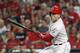 Cincinnati Reds' Joey Votto hits an RBI single off Arizona Diamondbacks relief pitcher T.J. McFarland in the eighth inning of a baseball game, Saturday, Aug. 11, 2018, in Cincinnati. (AP Photo/John Minchillo)