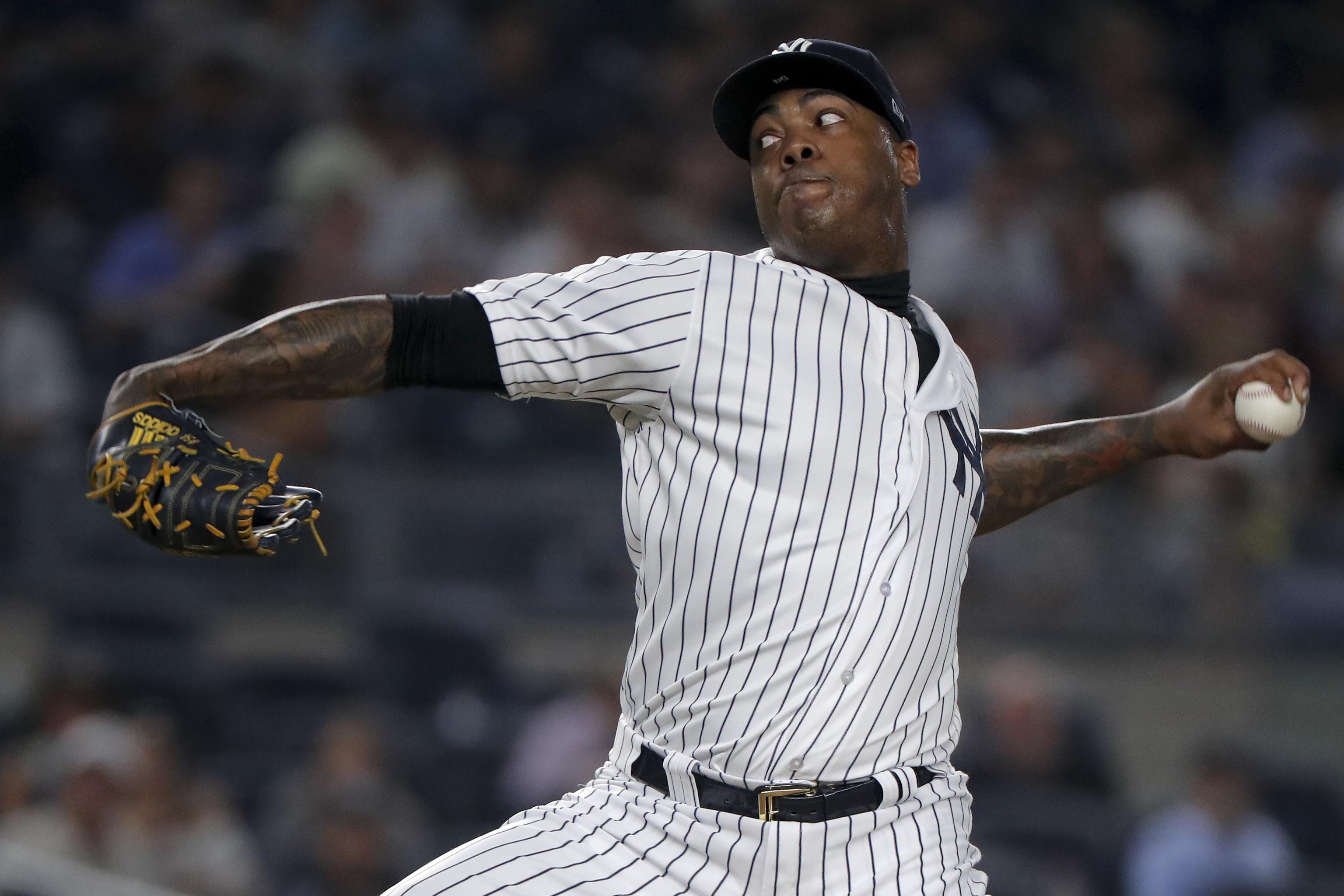 Chicago Cubs reliever AROLDIS CHAPMAN throws a strike