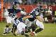 Tennessee Titans wide receiver Nick Williams (14) loses his helmet as he tries to bring down Tampa Bay Buccaneers running back Shaun Wilson, right, in the second half of a preseason NFL football game Saturday, Aug. 18, 2018, in Nashville, Tenn. (AP Photo/James Kenney)