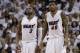 Miami Heat forward Udonis Haslem (40) and guard Dwyane Wade (3) look up during the second half of Game 3 of an NBA second-round playoff basketball series against the Toronto Raptors, Saturday, May 7, 2016, in Miami. (AP Photo/Alan Diaz)