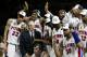 Detroit Pistons coach Larry Brown and his players celebrate the Piston 100-87 victory over the Los Angeles Lakers in Game 5 of the NBA Finals in Auburn Hills, Mich. Tuesday night June 15, 2004. Joining Brown are, Tayshaun Prince (22) Corliss Williamson, rear, and Rasheed Wallace (30) .(AP Photo/ Michael Conroy )