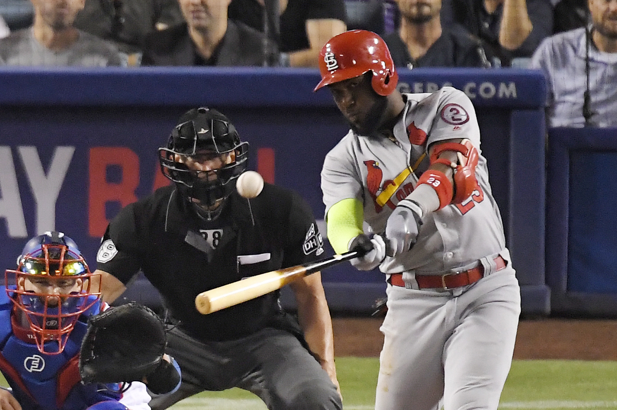 St. Louis Cardinals' Marcell Ozuna, right, leaves the field with an injury  accompanied by a trainer during the third inning of a baseball game against  the San Diego Padres Friday, June 28