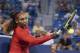 Serena Williams returns to Petra Kvitova, of the Czech Republic, at the Western & Southern Open tennis tournament, Tuesday, Aug. 14, 2018, in Mason, Ohio. (AP Photo/John Minchillo)