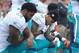 FOXBORO, MA - SEPTEMBER 18: Kenny Stills #10 of the Miami Dolphins (C) kneels during the national anthem before the game against the New England Patriots at Gillette Stadium on September 18, 2016 in Foxboro, Massachusetts. (Photo by Maddie Meyer/Getty Images)