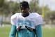 Miami Dolphins tight end Julius Thomas walk off the field after practice during an NFL football training camp, Monday, Aug. 7, 2017, in Davie, Fla. (AP Photo/Lynne Sladky)