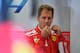 Ferrari's German driver Sebastian Vettel looks on in the pits during the third practice session at the Spa-Francorchamps circuit in Spa on August 25, 2018 ahead of the Belgian Formula One Grand Prix. (Photo by EMMANUEL DUNAND / AFP) (Photo credit should read EMMANUEL DUNAND/AFP/Getty Images)