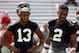 FILE - In this Aug. 4, 2018, file photo, Alabama quarterbacks Jalen Hurts (2) and Tua Tagovailoa (13) runs drills during an NCAA college football practice, in Tuscaloosa, Ala. Alabama enters game week with no answer, publicly at least, to the question of who will start at quarterback against Louisville. (AP Photo/Butch Dill, File)