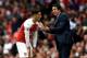LONDON, ENGLAND - AUGUST 12: Unai Emery, Manager of Arsenal speaks with Mesut Ozil of Arsenal during the Premier League match between Arsenal FC and Manchester City at Emirates Stadium on August 12, 2018 in London, United Kingdom. (Photo by Shaun Botterill/Getty Images)
