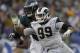 FILE - In this Dec. 10, 2017, file photo, Los Angeles Rams defensive end Aaron Donald, right, gets past Philadelphia Eagles offensive tackle Lane Johnson during an NFL football game in Los Angeles. Donald is not attending the Rams' mandatory minicamp while he continues his lengthy quest for a lucrative new contract. Donald wasn't on the field with his teammates for the Rams' first minicamp workout Tuesday, June 12, 2018. and he wasn't at their training complex for their off-field commitments Monday, either. The NFL Defensive Player of the Year also skipped the Rams' voluntary workout program over the previous two months. (AP Photo/Mark J. Terrill, File)