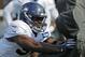 Seattle Seahawks defensive end Rasheem Green hits a blocking sled during NFL football training camp, Sunday, July 29, 2018, in Renton, Wash. (AP Photo/Ted S. Warren)