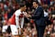 LONDON, ENGLAND - AUGUST 12: Unai Emery, Manager of Arsenal speaks with Mesut Ozil of Arsenal during the Premier League match between Arsenal FC and Manchester City at Emirates Stadium on August 12, 2018 in London, United Kingdom. (Photo by Shaun Botterill/Getty Images)