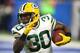 DETROIT, MI - DECEMBER 29: Jamaal Williams #30 of the Green Bay Packers runs for yardage against the Detroit Lions during the first half at Little Caesars Arena on December 29, 2017 in Detroit, Michigan. (Photo by Gregory Shamus/Getty Images)