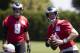 PHILADELPHIA, PA - JUNE 12: Carson Wentz #11 of the Philadelphia Eagles looks to pass the ball while Nick Foles #9 looks on during Eagles minicamp at the NovaCare Complex on June 12, 2018 in Philadelphia, Pennsylvania. (Photo by Mitchell Leff/Getty Images)