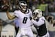 New York Jets' Xavier Cooper (75) grabs Philadelphia Eagles' Christian Hackenberg (8) during the second half of a preseason NFL football game Thursday, Aug. 30, 2018, in Philadelphia. (AP Photo/Matt Rourke)