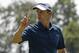 Justin Rose, of England, reacts after making a putt on the first green during the third round of the PGA Championship golf tournament at Bellerive Country Club, Saturday, Aug. 11, 2018, in St. Louis. (AP Photo/Brynn Anderson)