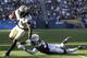 New Orleans Saints running back Alvin Kamara gets away from Los Angeles Chargers defensive back Derwin James during the first half of an NFL preseason football game Saturday, Aug. 25, 2018, in Carson, Calif. (AP Photo/Marcio Jose Sanchez)