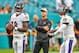 MIAMI, FL - AUGUST 25: Lamar Jackson #8 and Robert Griffin III #3 of the Baltimore Ravens warm up in front of head coach John Harbaugh of the Baltimore Ravens before a preseason game against the Miami Dolphins at Hard Rock Stadium on August 25, 2018 in Miami, Florida. (Photo by Mark Brown/Getty Images)