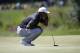 Tiger Woods lines up a putt on the fifth hole during the third round of the Dell Technologies Championship golf tournament at TPC Boston in Norton, Mass., Sunday, Sept. 2, 2018. (AP Photo/Michael Dwyer)