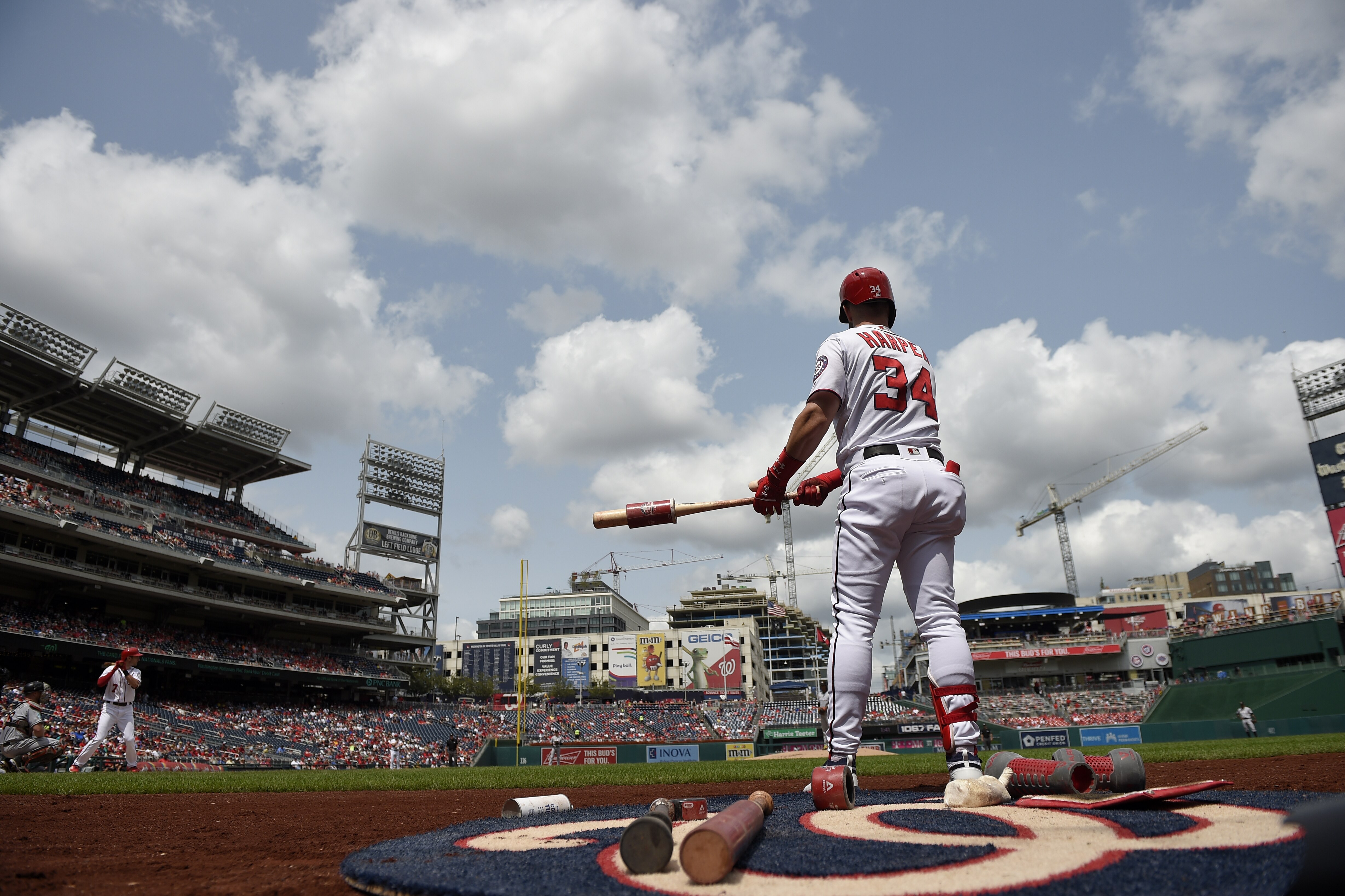 Washington Nationals' Bryce Harper warms up by the on deck circle during the first inning of a baseball game against the Miami Marlins, Sunday, Aug. 19, 2018, in Washington. The Marlins won 12-1. (AP Photo/Nick Wass)