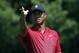 Tiger Woods indicates the direction of the wind before teeing off on the third hole during the final round of the Dell Technologies Championship golf tournament at TPC Boston in Norton, Mass., Monday, Sept. 3, 2018. (AP Photo/Michael Dwyer)