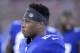 New York Giants running back Saquon Barkley looks on from the bench during the first half of an NFL preseason football game against the New England Patriots, Thursday, Aug. 30, 2018, in East Rutherford. (AP Photo/Bill Kostroun)