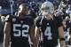 Oakland Raiders defensive end Khalil Mack (52) and quarterback Derek Carr (4) before an NFL football game against the Indianapolis Colts in Oakland, Calif., Saturday, Dec. 24, 2016. (AP Photo/Marcio Jose Sanchez)
