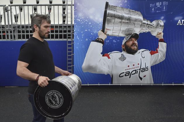 Washington Capitals Alex Ovechkin, from Russia, carries the Stanley Cup trophy at the fan zone in Moscow ahead of the the quarterfinal match between Russia and Croatia at the 2018 soccer World Cup that is being played in the Fisht Stadium, in Sochi, Russia, Saturday, July 7, 2018. Ovechkin is bringing the Stanley Cup to the World Cup. Fresh off winning the NHL title, the Washington Capitals forward is taking the trophy to Moscow on Saturday, where it will be exhibited at a