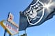 LAS VEGAS, NV - APRIL 29: An Oakland Raiders flag is shown during the team's 2017 NFL Draft event at the Welcome to Fabulous Las Vegas sign on April 29, 2017 in Las Vegas, Nevada. National Football League owners voted in March to approve the team's application to relocate to Las Vegas. The Raiders are expected to begin play no later than 2020 in a planned 65,000-seat domed stadium to be built in Las Vegas at a cost of about USD 1.9 billion. (Photo by Sam Wasson/Getty Images)