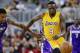 Los Angeles Lakers' Luol Deng (9) and Sacramento Kings' Rudy Gay scramble for a loose ball during the first half of an NBA preseason basketball game Thursday, Oct. 13, 2016, in Las Vegas. (AP Photo/Isaac Brekken)