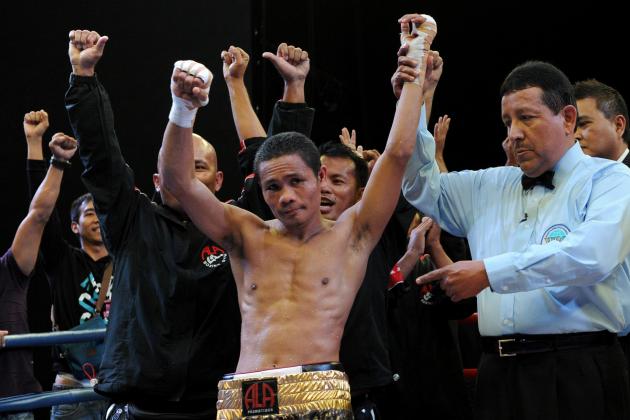 World Boxing Organization light-flyweight champion Donnie Nietes (C) of the Philippines celebrates after defeating Mexican challenger Felipe Salguero on June 2, 2012 during a WBO light-flyweight title bout in Manila, retaining his title. AFP PHOTO / Jay DIRECTO (Photo credit should read JAY DIRECTO/AFP/GettyImages)