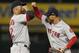 Boston Red Sox's Mookie Betts, right, and Xander Bogaerts celebrate the team's 9-4 win over the Chicago White Sox in a baseball game Thursday, Aug. 30, 2018, in Chicago. (AP Photo/Jim Young)