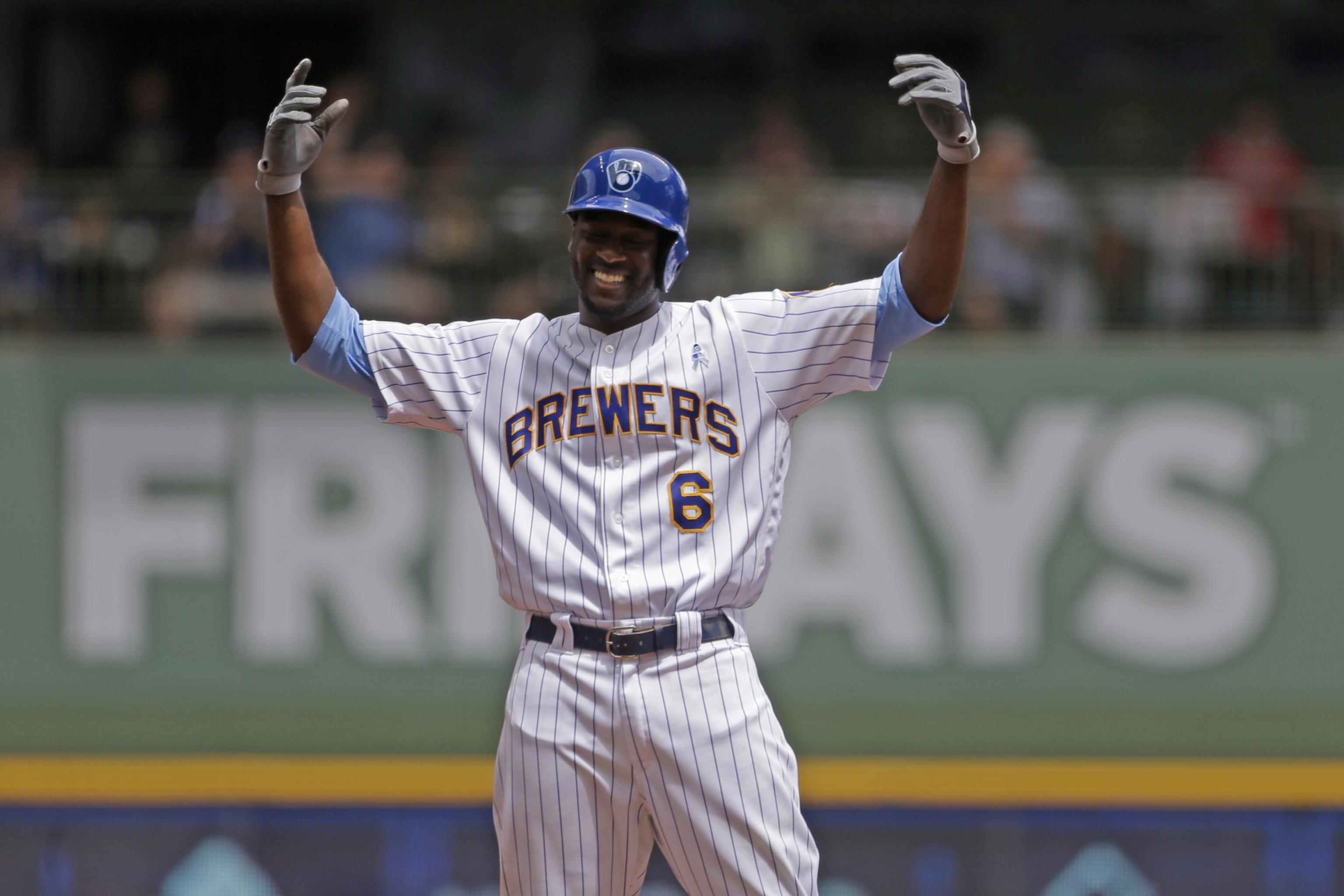Milwaukee Brewers' center fielder Lorenzo Cain celebrates after hitting a double at Miller Park.