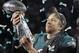 Philadelphia Eagles' Nick Foles holds up the Vince Lombardi Trophy after the NFL Super Bowl 52 football game against the New England Patriots, Sunday, Feb. 4, 2018, in Minneapolis. The Eagles won 41-33. (AP Photo/Matt Slocum)