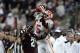 COLLEGE STATION, TX - SEPTEMBER 08: Tee Higgins #5 of the Clemson Tigers leaps over Charles Oliver #21 of the Texas A&M Aggies to make a catch and runs for a 64 yard touchdown in the second quarter at Kyle Field on September 8, 2018 in College Station, Texas. (Photo by Bob Levey/Getty Images)