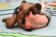 DALLAS, TX - SEPTEMBER 08: (L-R) Tyron Woodley attempts to submit Darren Till of England in their UFC welterweight championship fight during the UFC 228 event at American Airlines Center on September 8, 2018 in Dallas, Texas. (Photo by Josh Hedges/Zuffa LLC/Zuffa LLC via Getty Images)